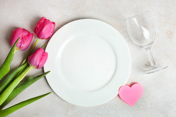 pink tulips. Romantic dinner
