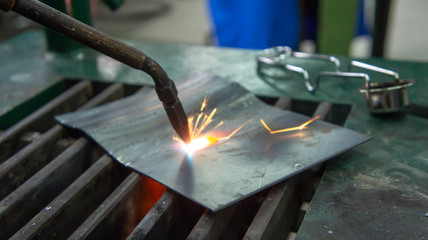 Oxy-acetylene gas welding or cutting in a metal workshop