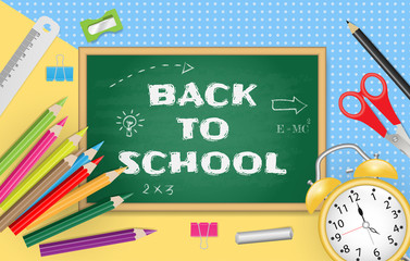 Back to school text on chalkboard with school supplies on colorful paper background