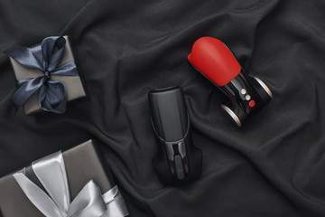 Add variety to your sex life! Close-up photo of sex toys in minimal design and gift boxes arranged...