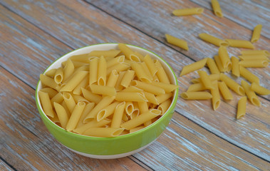 The​ Penne​ Rigate​ in​ a​ bowl​ on​ the​ table.