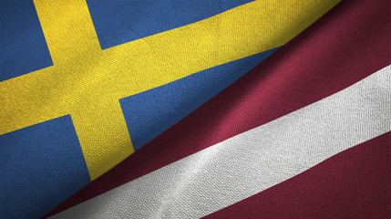 Sweden and Latvia two flags textile cloth, fabric texture