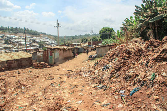 Kibera, Nairobi, Kenya - February 13, 2015: Huge heaps of burning garbage in the slums of Nairobi - one of the poorest places in Africa