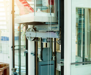 wheel rotating with sling cable by motor driven of passenger lift system © Koonsiri