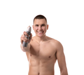 Fototapeta premium Handsome young man with deodorant on white background