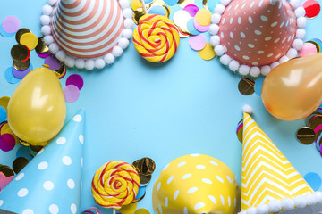 Frame made of Birthday decor on color background