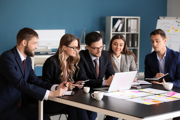 Group of people discussing business plan in office
