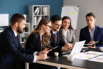 Group of people discussing business plan in office