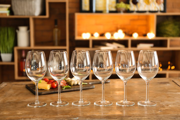 Empty wineglasses on wooden table