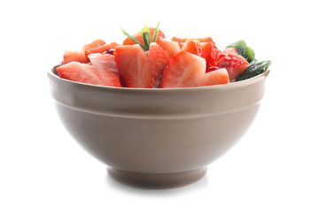 Bowl with tasty oatmeal on white background