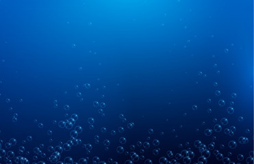 Blue water background with realistic bubbles or drops.