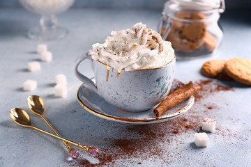 Cup of hot cacao drink on light table