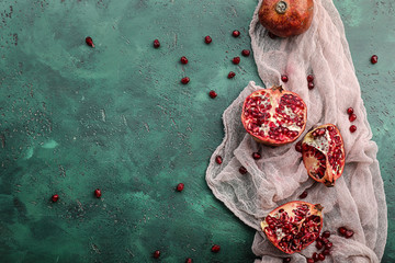 Pieces of ripe pomegranates on color table