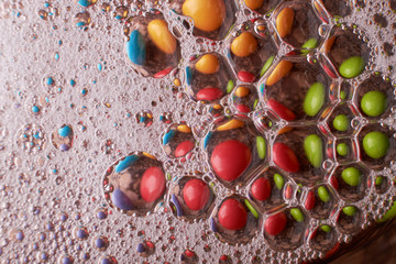 abstract background of colored drops bubbles on the water