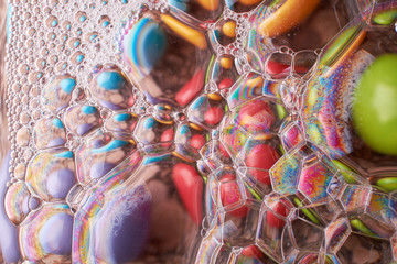abstract background of colored drops bubbles on the water