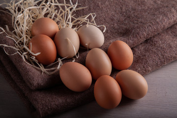 Raw chicken eggs scattered on the table.