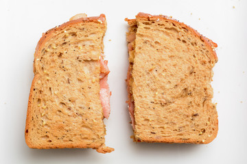 Freshly made bacon sandwich on a white plate
