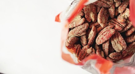 Expired food in plastic container, Close up of fungus on expire organic pecan nuts, unhealthy for your health, can't to eat. toxic food. 