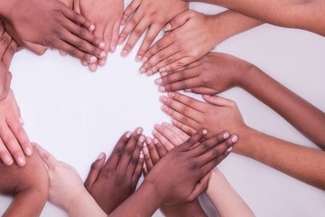 multi national skin colour hands in a heart shape