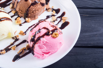 Ice cream with walnuts and chocolate topping