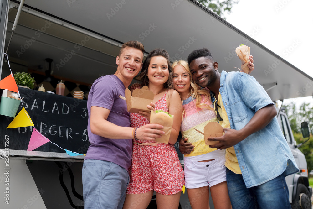 Poster leisure, eating and people concept - happy friends with wok and burger at food truck