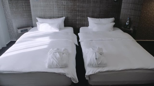 Two Single Beds With Shower Amenities