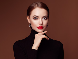Beautiful Young Woman with Clean Fresh Skin. Perfect Makeup. Beauty Fashion. Red Lips. Cosmetic...