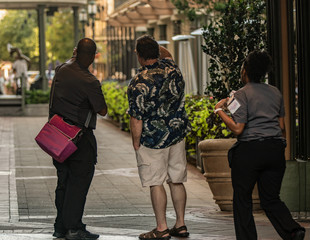 unknown tourist gets directions from a local