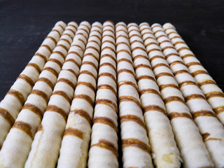 waffle rolls isolated with white cream. Sweet. Art soft focus.