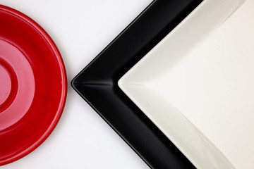 Different  plates on the white table.Top view.