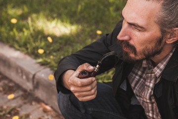 Bearded man smoking pipe