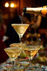 fulling up pyramid of champagne © kravtsov