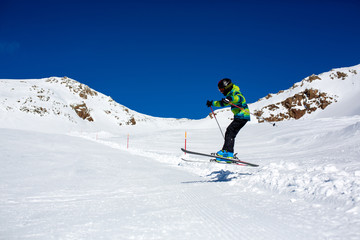 Fototapeta na wymiar Happy people, children and adults, skiing on a sunny day in Tyrol mountains