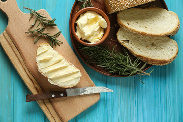 Composition with tasty bread and butter on table
