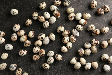 Many quail eggs on table