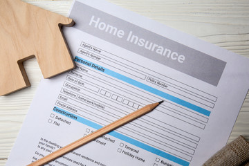Home insurance form on white table