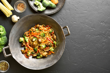 Udon stir-fry noodles with vegetables in wok