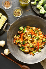 Udon stir-fry noodles with vegetables in wok