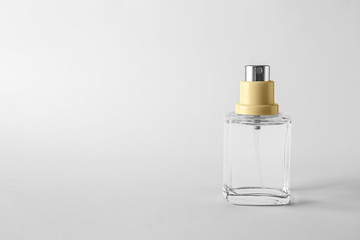 Bottle of perfume on white background