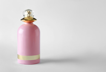 Bottle of perfume on white background