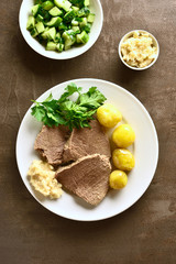 Boiled beef with potatoes and horseradish