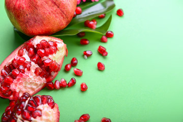 Ripe pomegranates on color background