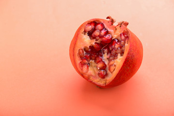 Ripe pomegranate on color background