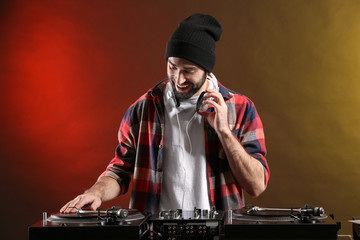 Male DJ playing music in club