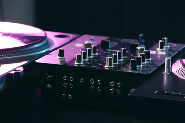 Modern DJ mixer in club, closeup