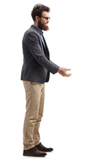 Bearded man standing and waiting to receive something