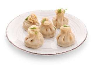 Plate with tasty dumplings on white background