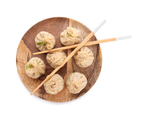Plate with tasty dumplings on white background