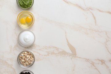 Natural ingredients for cosmetic on light background