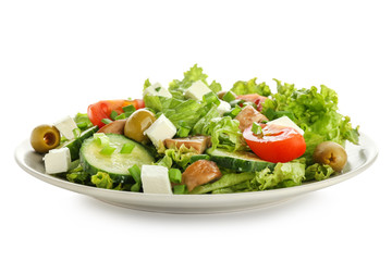 Plate with tasty fresh salad on white background